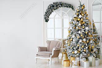 Holiday decorated room with Christmas tree and armchair