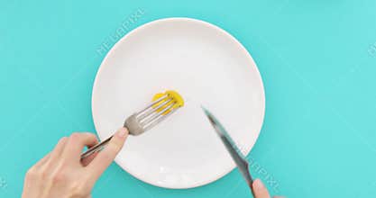 Female hands with cutlery and empty plate