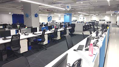 Computers and telephones in the work station an information technology company.