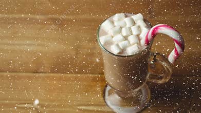 Falling snow with Christmas hot chocolate