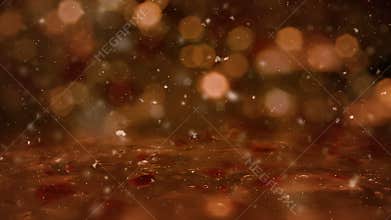 Winter Golden Motion background lights, snow falling on ice defocused bokeh loop