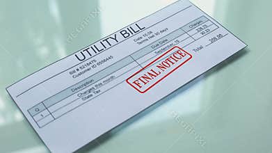 Utility bill final notice, hand stamping seal on document, payment for services