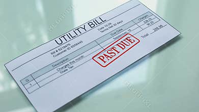 Utility bill past due, hand stamping seal on document, payment for services