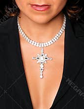 Neckline and bra-less chest of young attractive girl with diamond necklace on.