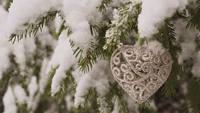 New Year Heart shaped Decoration hanging on fir tree
