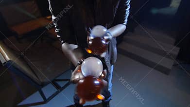 4K Black Magician juggles four balls. Two in each hand