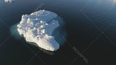 Iceberg float in clear water ocean drone above view