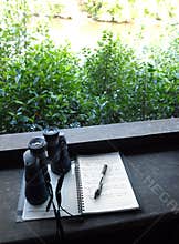 Binoculars and bird watching notes