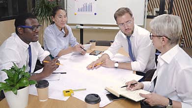 Chief architect checking engineering group work.