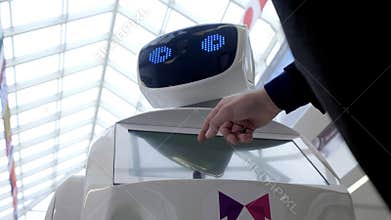 Cybernetic system today. Modern Robotic Technologies. Humanoid autonomous robot. a man using his touch screen. High tech