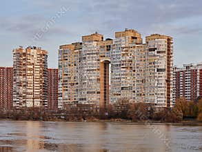 JK Novyj Gorod. Beautiful autumn view of the complex of residential buildings with all the infrastructure. Houses are reflected