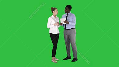 Modern business people working on a tablet on a Green Screen, Chroma Key.