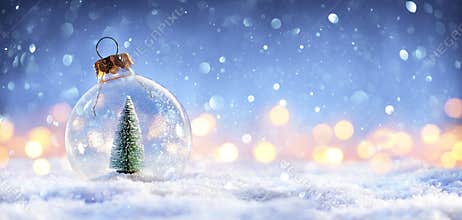 Snow Ball With Christmas Tree In It And Lights