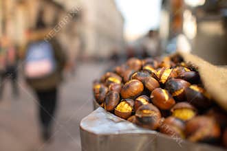 Roasted chestnuts for sale on the street in the city in the fall