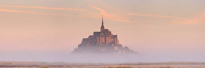 Le Mont Saint Michel in Normandy, France at sunrise
