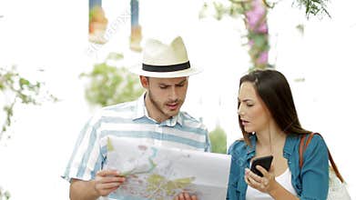 Confused tourists searching location on vacation
