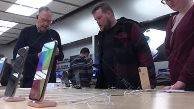 Motion of people buying iphone and paying credit card