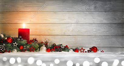 Christmas or Advent wood background with a candle