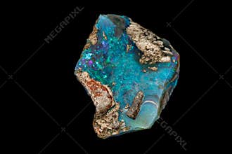 Macro stone Opal mineral in rock on a black background
