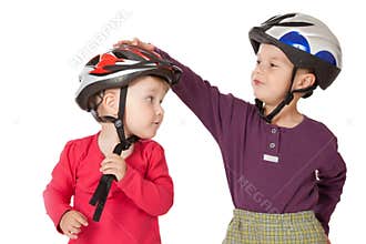 Childs in bicycle helmets