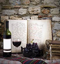 Wine bottle and old books