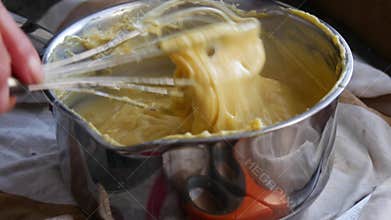 Preparation of custard pastry cream in a bowl, ingredient patisserie.