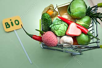 Health bio organic food concept, Shopping cart  in supermarket full of fruits and vegetables, .top view