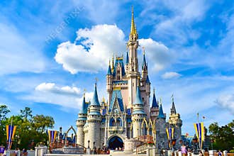 Panoramic view of Cinderella`s Castle on lightblue cloudy sky background in Magic Kingdom at Walt Disney World  1