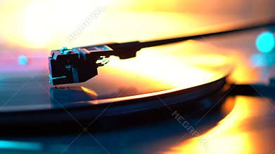Cinemagraph loop vinyl record player turntable with it`s stylus running along music plate. Neon light. Retro-styled