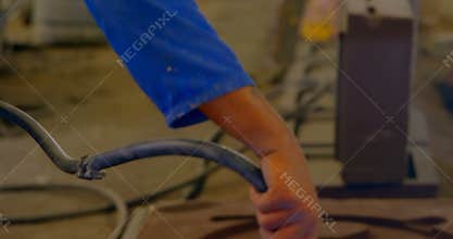 Man using air compressor in foundry workshop 4k
