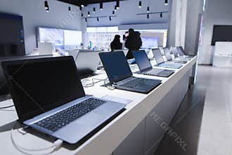 Laptops in a modern technology store. Department of computers in the electronics store. laptop in the store