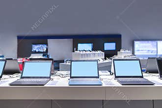 Laptops in the modern electronics store. Computer department in the technology store