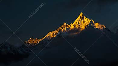 The first sun shines on the snow peak