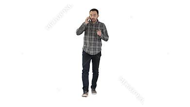 Serious man walking and talking on his cellphone on white background.