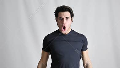 Expression of joy for victory on handsome young man