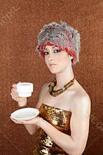 Fashion futuristic gold coffee cup on bronze