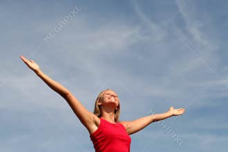 Happy woman with her arms wide open