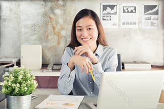 New generation asians business woman using laptop at office