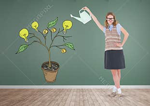 Woman holding watering can and Drawing of Money and idea graphics on plant branches on wall