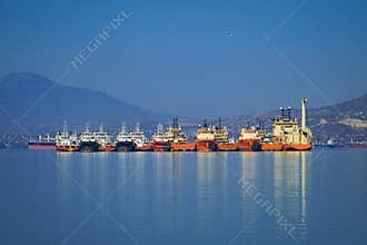 Anchored vessels side by side