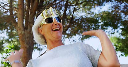 Senior woman wearing party props