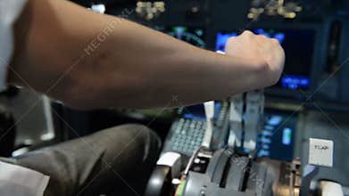 Pilot pushing power handle and cancel