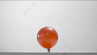 Bursting red balloon