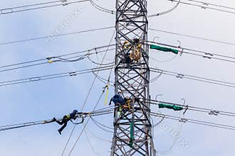 Electricians Hanging Tower Power Lines