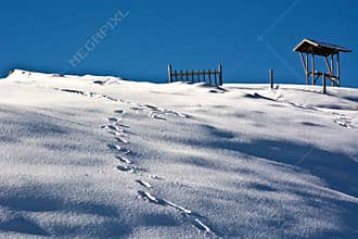 Imprints footsteps in the snow a day of blue sky