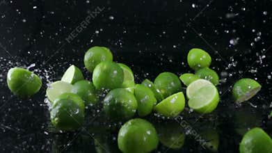 Lime splashing on black background