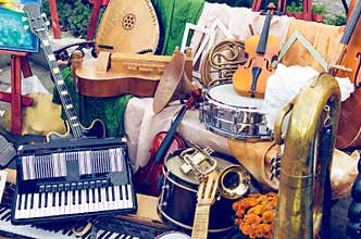 Pile of different old musical instruments