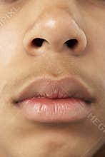 Close-Up Of Young Boy's Mouth And Nose