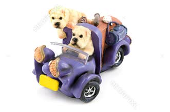 Two dags riding in a purple car