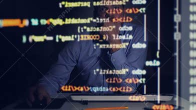 Programmer scrolling down programming code on computer screen